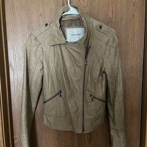 Maurice’s tan leather motorcycle jacket